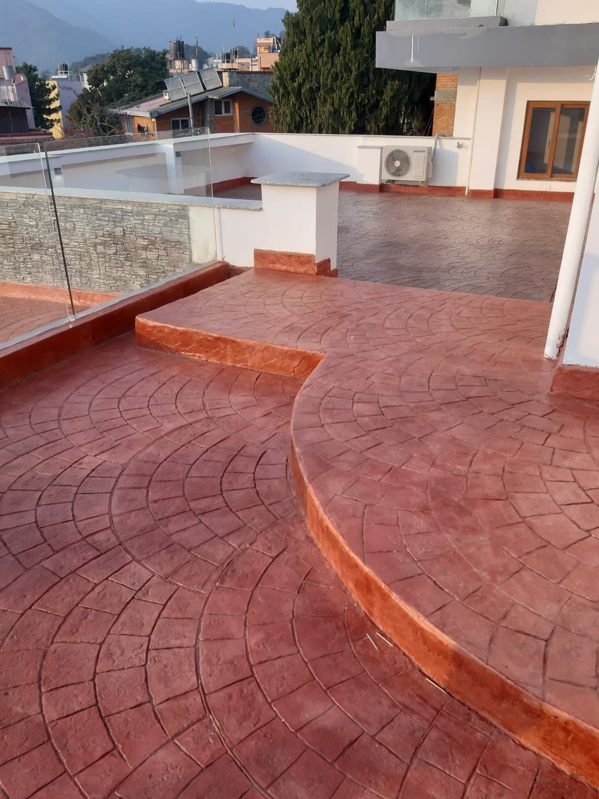 Red stamped concrete terrace