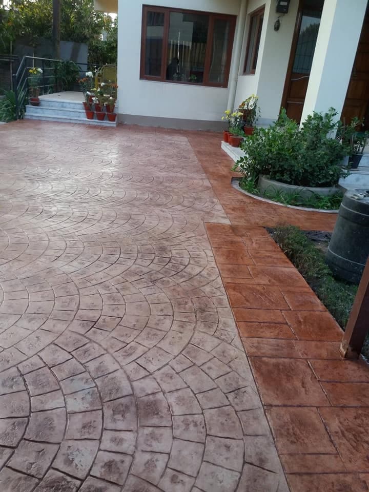 Stamped concrete patio beside a home